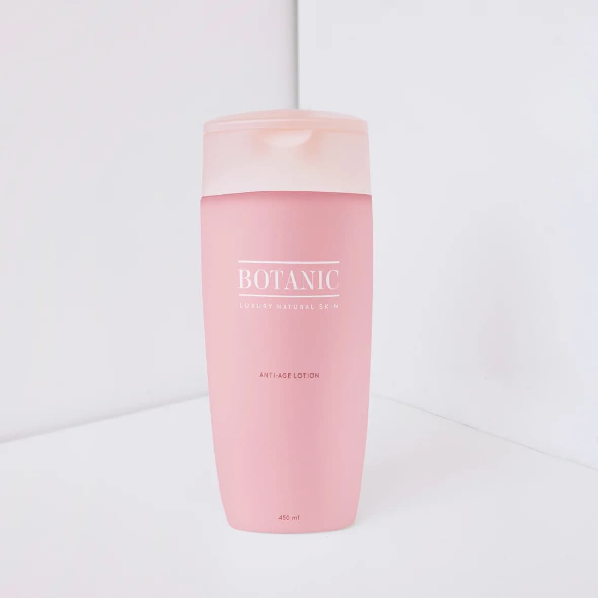 Firming Body Lotion, blush pink bottle in a bright white corner